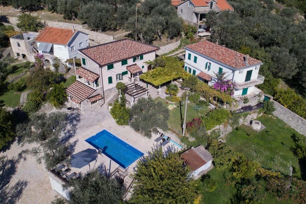 Aerial view of Villa Ella surrounded by olive groves in Stari Bar, Montenegro